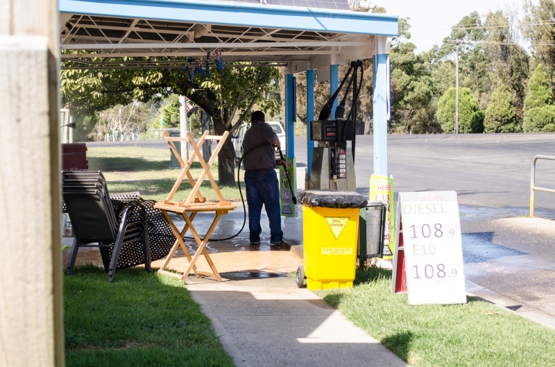 Karens New Berrima Store - Geoff Hanratty out inforce again today washing away diesel and petrol oil spills with his industrial water pressure unit. Notice the Councils Oil Spill yellow bin is just for show.